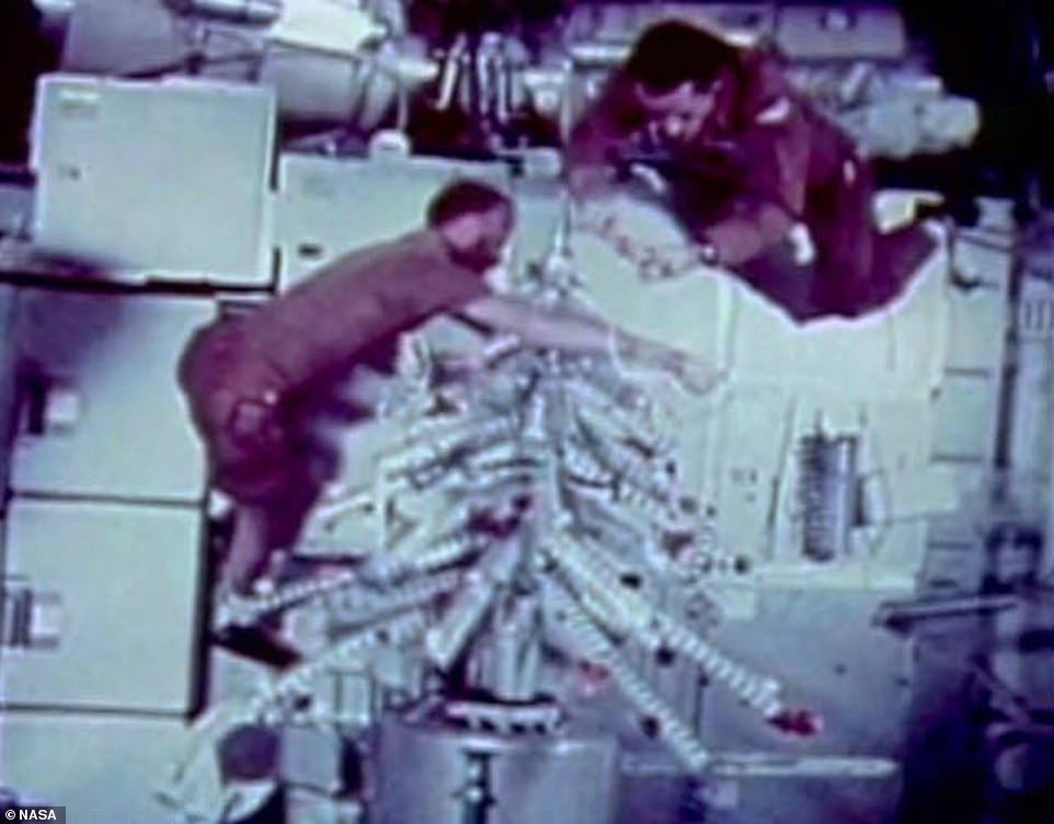 The first Christmas tree in space: Astronauts Gerald P. Carr, William R. Pogue and Edward G. Gibson spent the holidays aboard NASA's Skylab in 1973, which was America's first space station.  The crew assembled a tree using leftover food containers and decorated it with colored decals