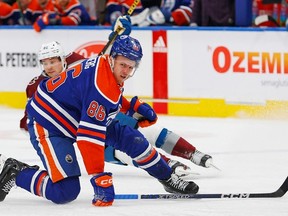 Edmonton Oilers defenseman Philip Broberg (86) reacts after being hit in the face with a puck against the Colorado Avalanche during the second period at Rogers Place.